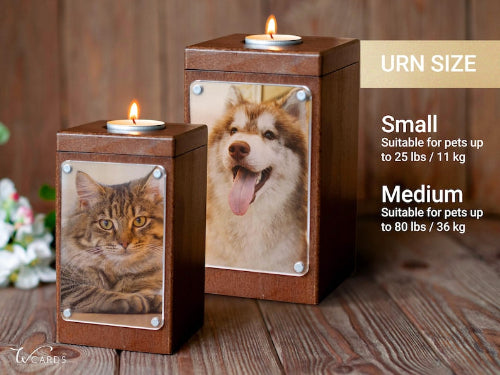 Two wooden pet urn candle holders with custom pet photos on the front, shown on a rustic wood surface. One holds a tabby cat and the other holds a husky dog.