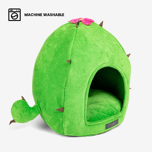 Green pet bed shaped like a cactus with a pink flower on a white background