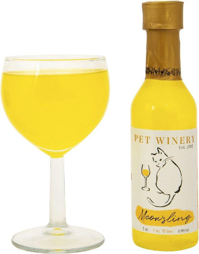 Bottle of Pet Winery Meowsling cat wine with a glass of yellow liquid on a white background